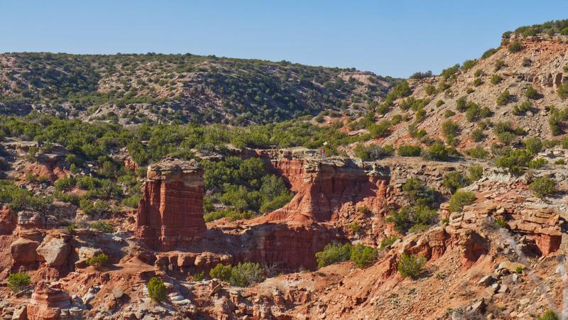 The Kneeling Camel rock formation rising from the canyon