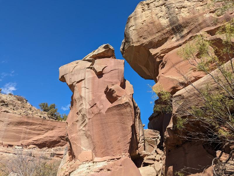 Red hoodoo against blue sky
