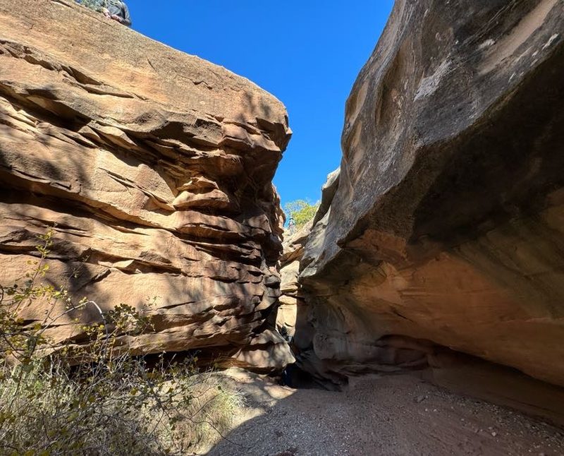 Sunlit view down Palo Duro Canyon from a sandstone ledge
