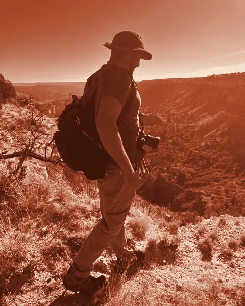 Hiker with a daypack on the canyon rim